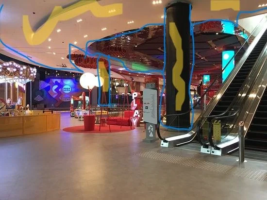 Colorful interior and escalator at Hupalupa Metropol